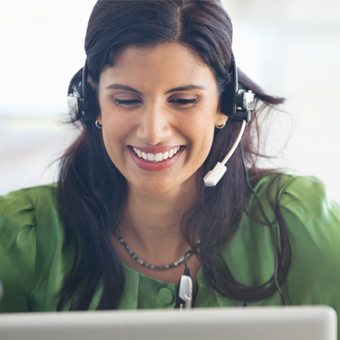 A young ethnic nurse on the phone. 